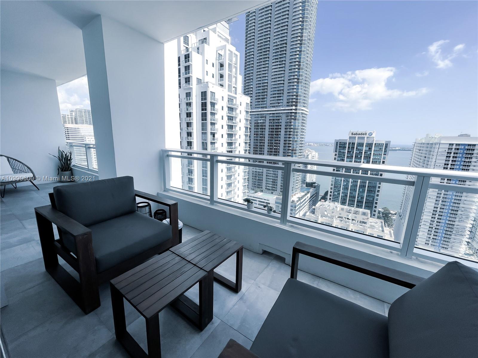 1080 Brickell Avenue, Unit 3702 Miami, FL 33131 - Photo 22 of 39 a living room with furniture and a window