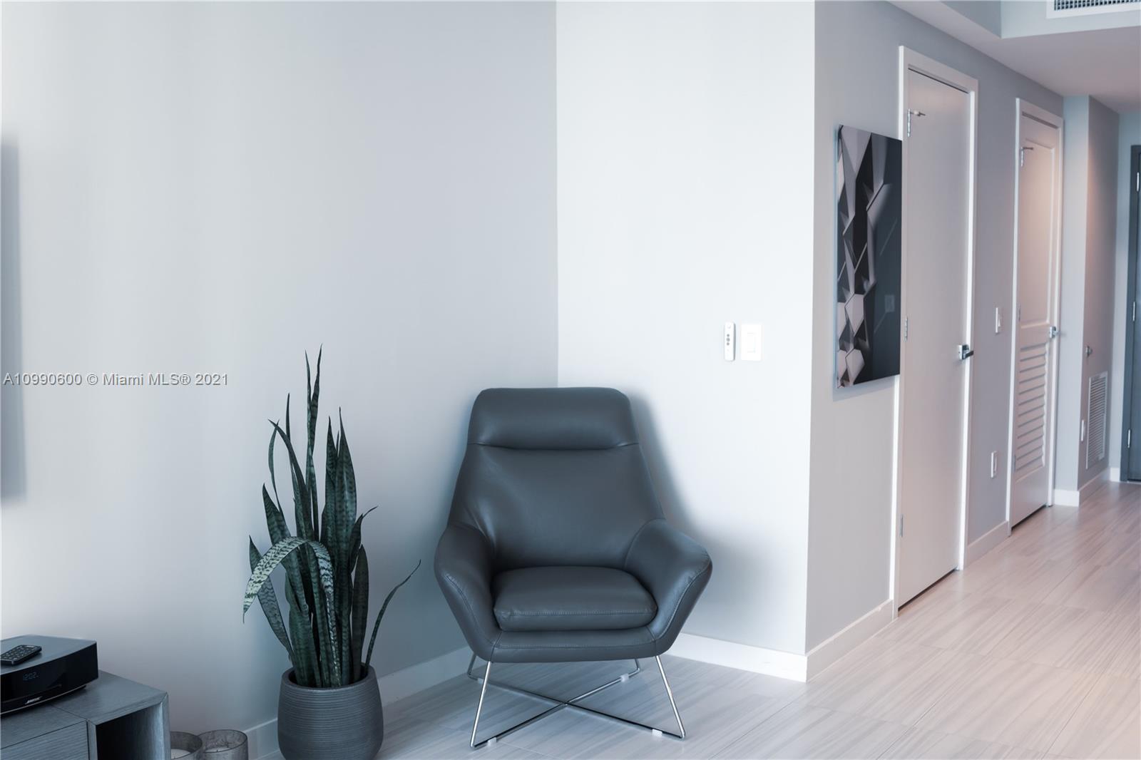 1080 Brickell Avenue, Unit 3702 Miami, FL 33131 - Photo 9 of 39 a view of a hallway with seating area