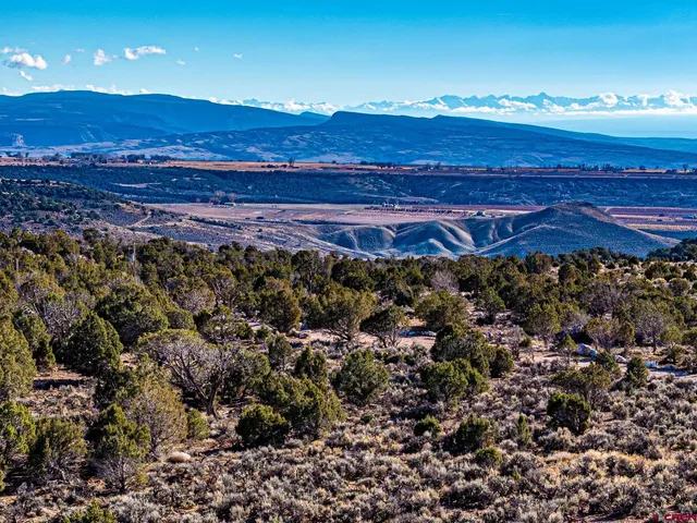 a view of an ocean and a mountain
