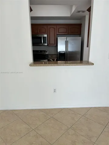 a kitchen with a stove and a microwave