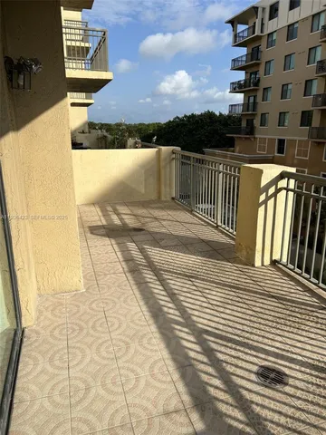 a view of a balcony with an outdoor space