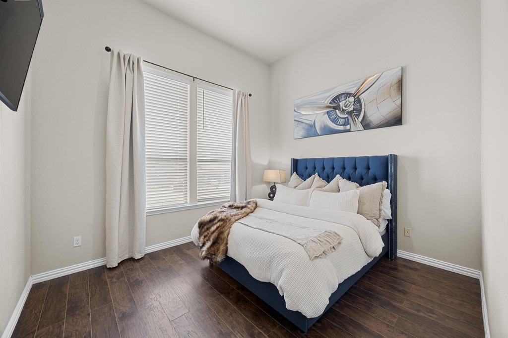 302 Southwind Road Lago Vista, TX 78645 - Photo 11 of 39 a bedroom with a bed and a window