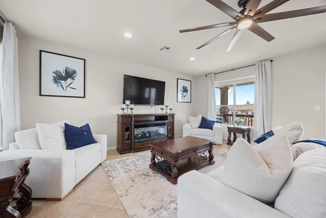 a living room with furniture and a large window