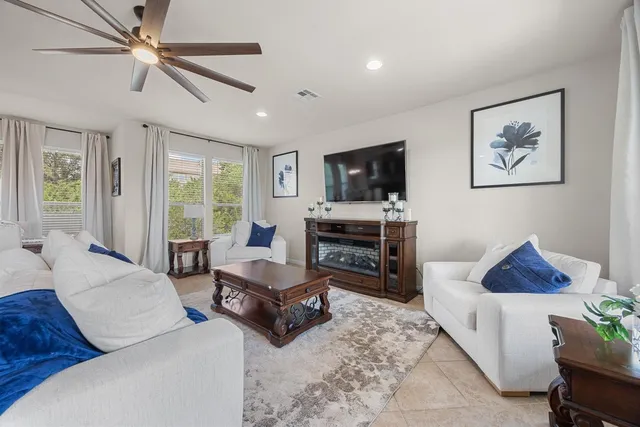 a dining room with furniture and window