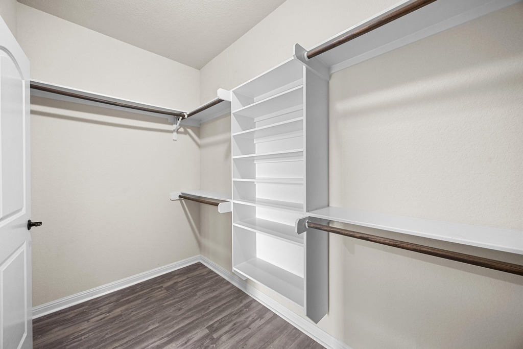 302 Southwind Road Lago Vista, TX 78645 - Photo 26 of 39 a view of walk in closet with empty racks
