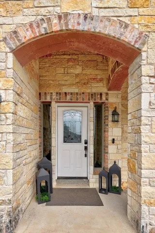 a front view of a building with potted plants