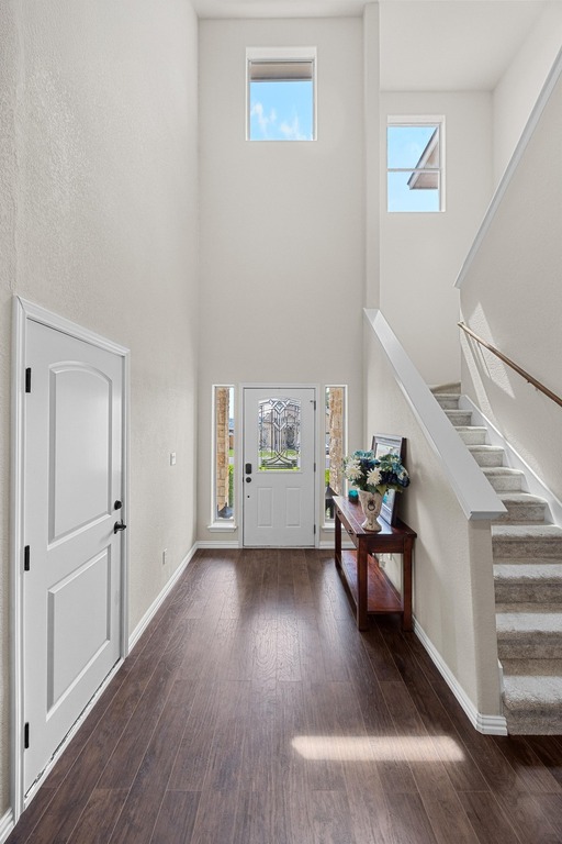 302 Southwind Road Lago Vista, TX 78645 - Photo 6 of 39 a view of an empty room with wooden floor and windows