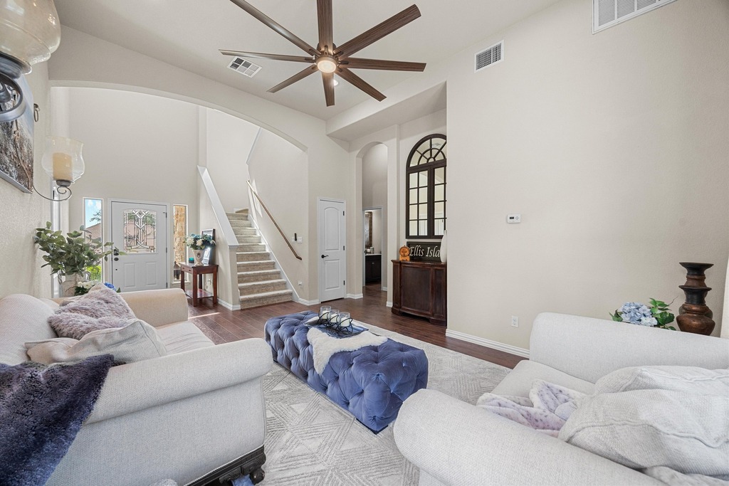 302 Southwind Road Lago Vista, TX 78645 - Photo 9 of 39 a living room with furniture and a chandelier