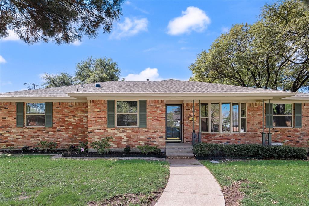 3106 Sharpview Lane Dallas, TX 75228 - Photo 2 of 33 a front view of a house with a garden