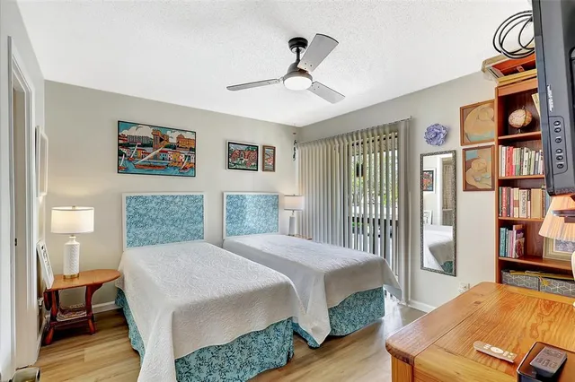 a bathroom with a sink toilet double vanity and shower