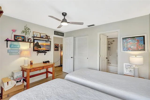 a bedroom with a bed furniture and a chandelier