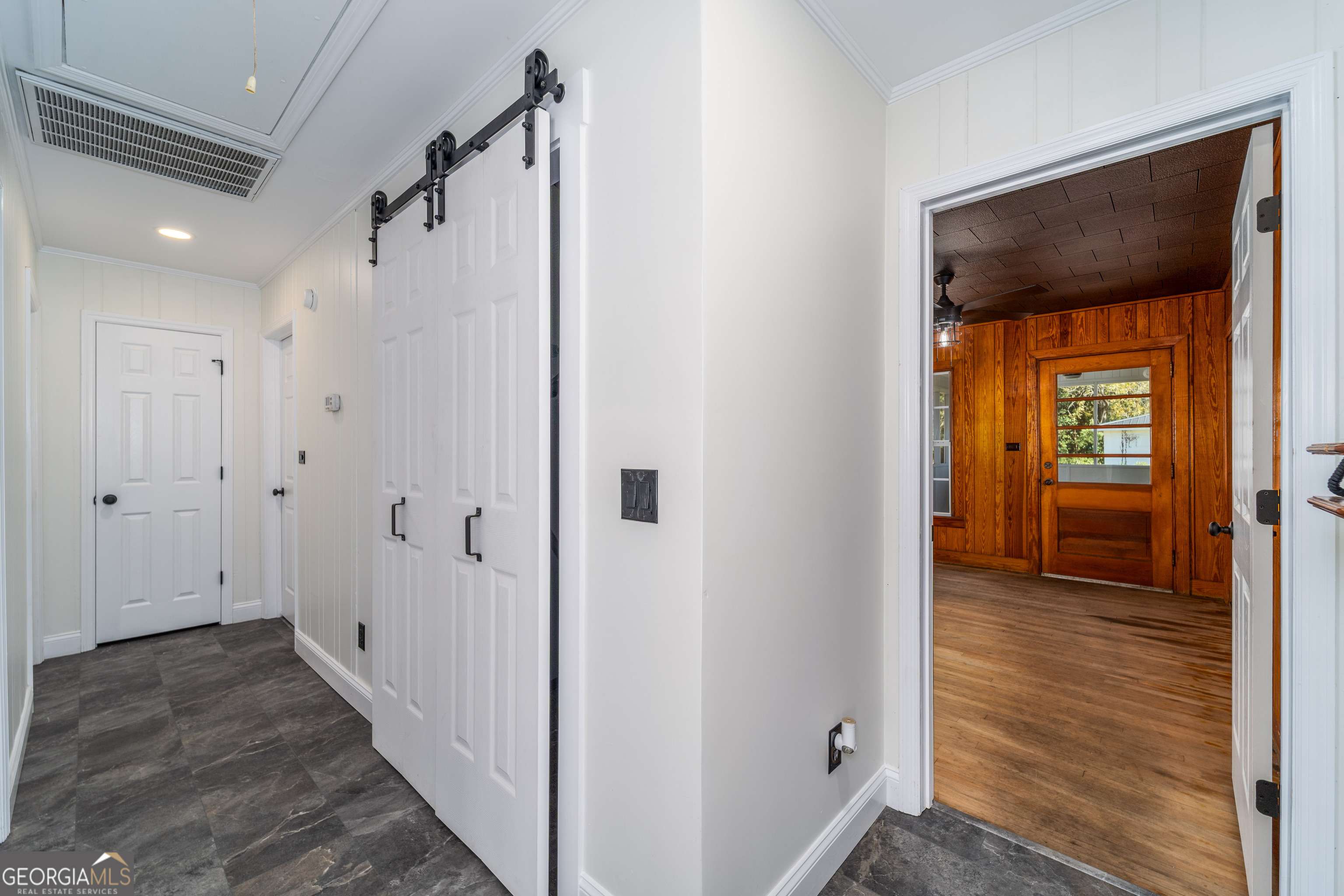 322 McGregor Street Blackshear, GA 31516 - Photo 15 of 30 a view of a hallway with wooden floor and closet