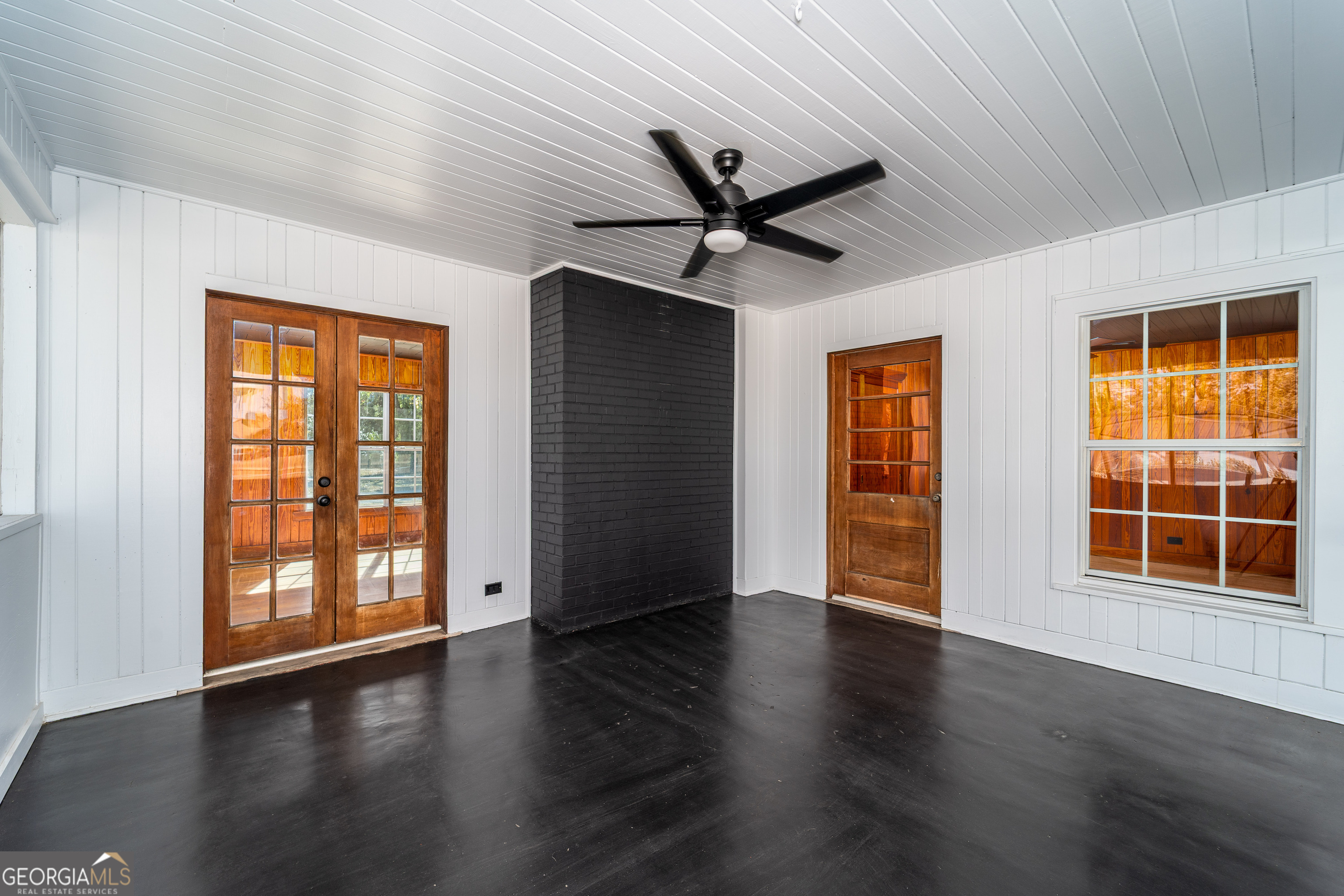322 McGregor Street Blackshear, GA 31516 - Photo 25 of 30 a view of an empty room with wooden floor and a window