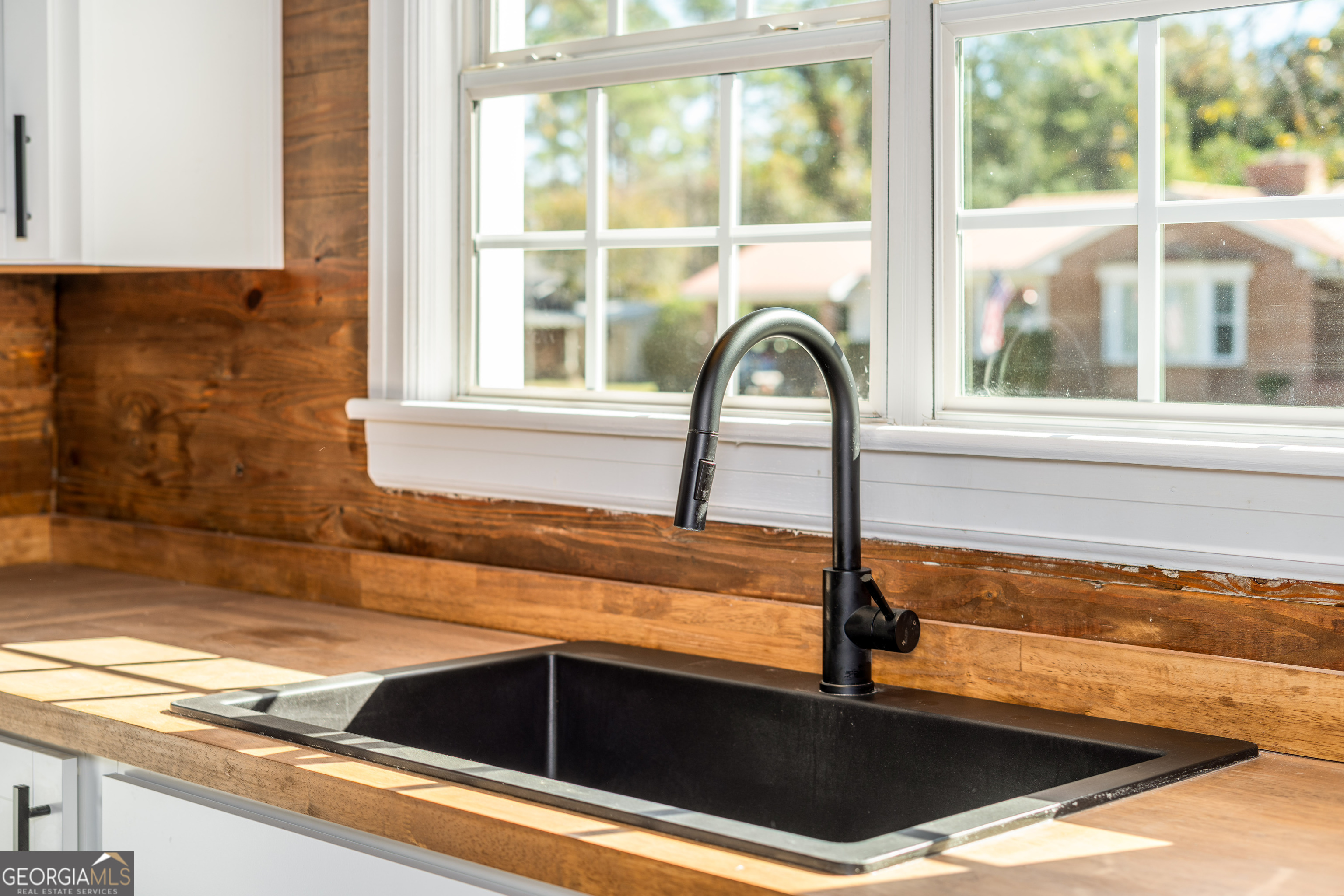 322 McGregor Street Blackshear, GA 31516 - Photo 8 of 30 a kitchen sink with a granite countertop window