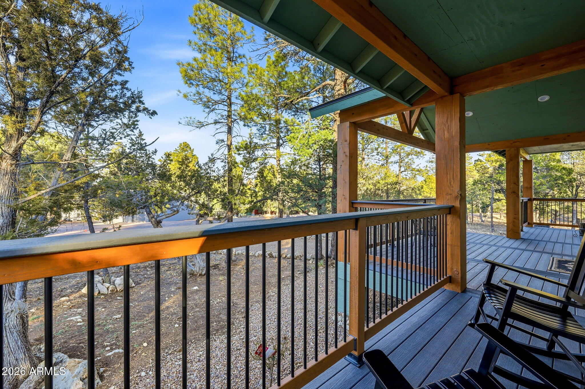 2225 Roundabout Way Overgaard, AZ 85933 - Photo 31 of 32 a view of a balcony with wooden floor