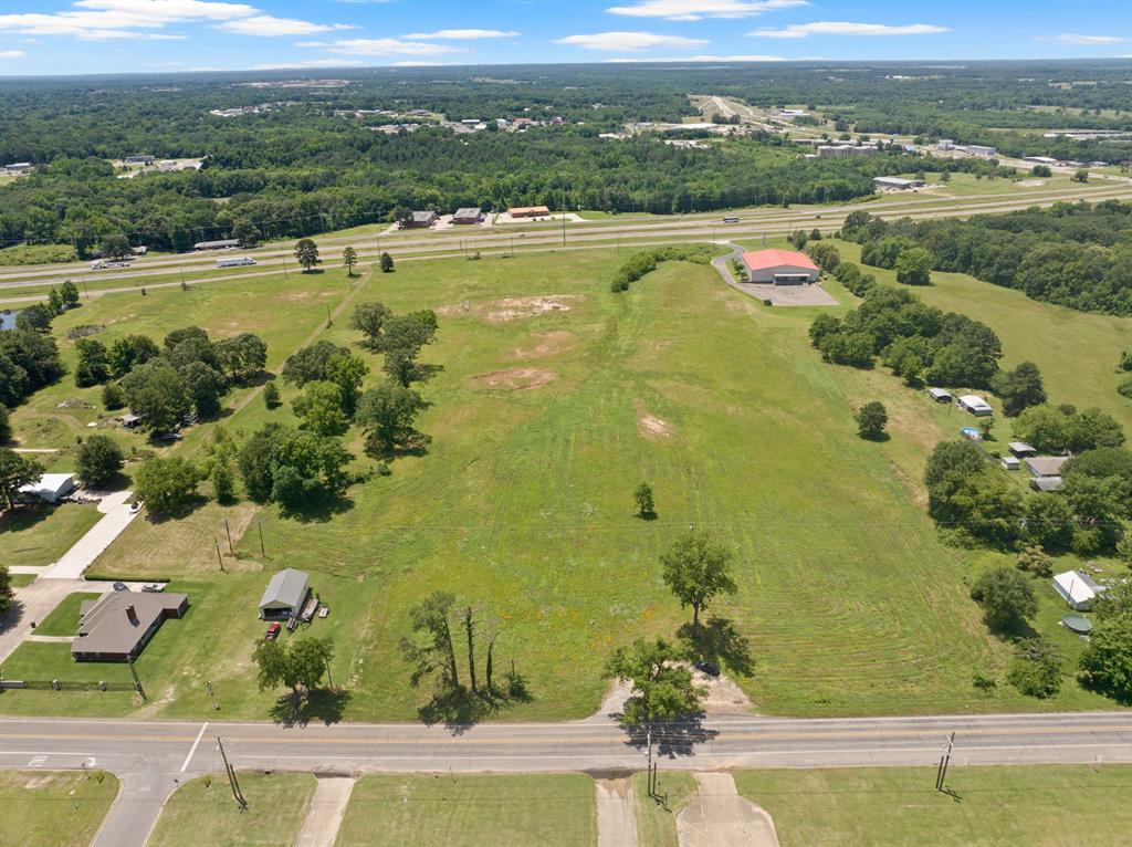 30 West Interstate 30 Service Road Mount Pleasant, TX 75455 - Photo 16 of 22 an aerial view of ocean with residential house and outdoor space