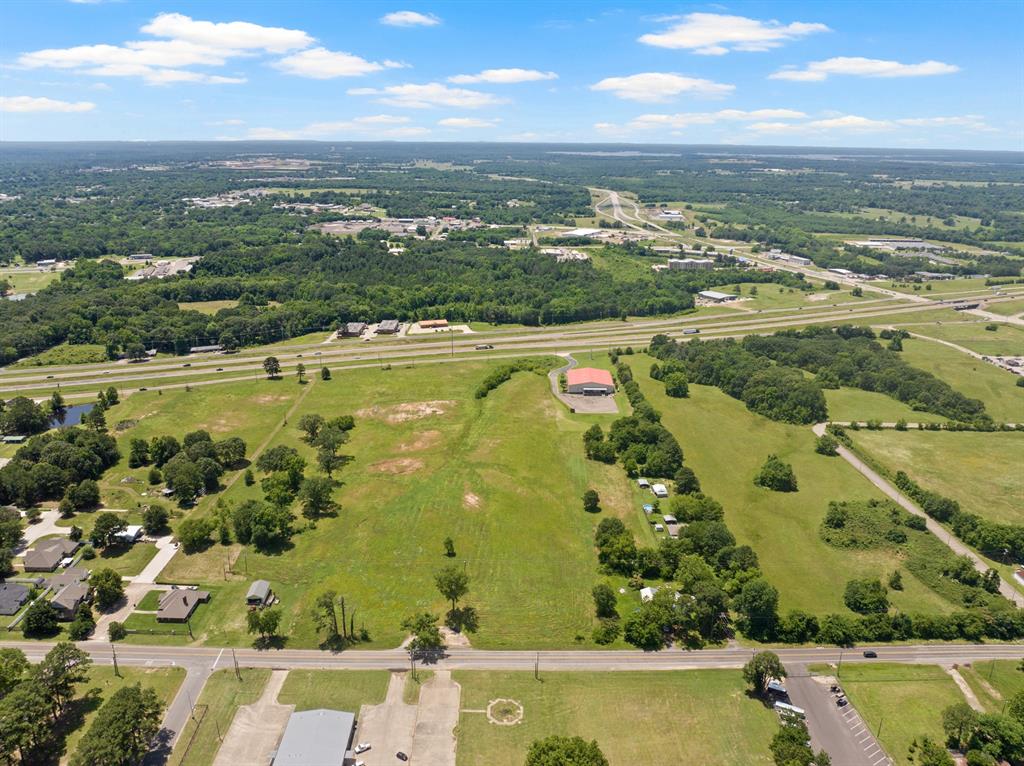 30 West Interstate 30 Service Road Mount Pleasant, TX 75455 - Photo 17 of 22 an aerial view of ocean with residential houses with outdoor space