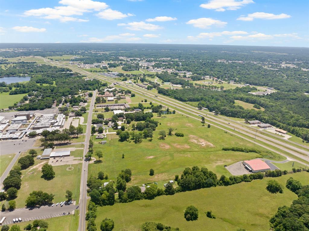 30 West Interstate 30 Service Road Mount Pleasant, TX 75455 - Photo 19 of 22 an aerial view of residential houses with outdoor space