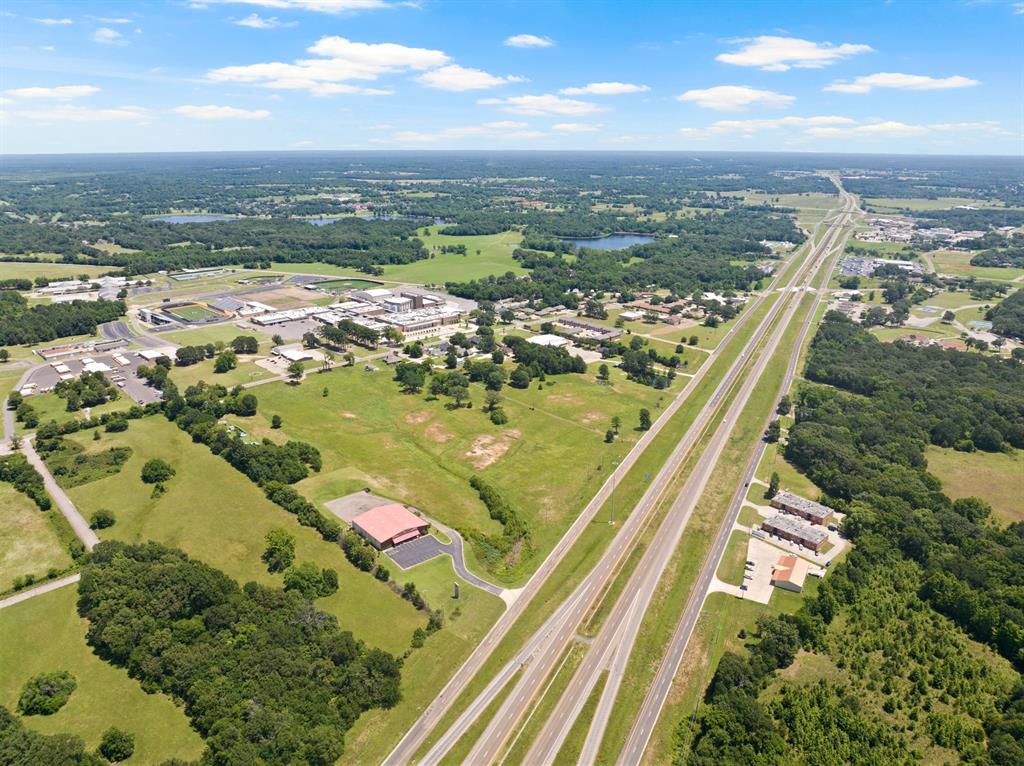 30 West Interstate 30 Service Road Mount Pleasant, TX 75455 - Photo 21 of 22 an aerial view of residential houses with outdoor space