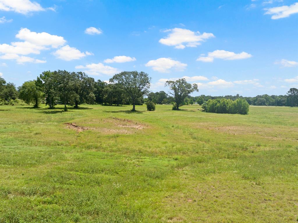 30 West Interstate 30 Service Road Mount Pleasant, TX 75455 - Photo 10 of 22 a view of a big yard with an outdoor seating and entertaining space