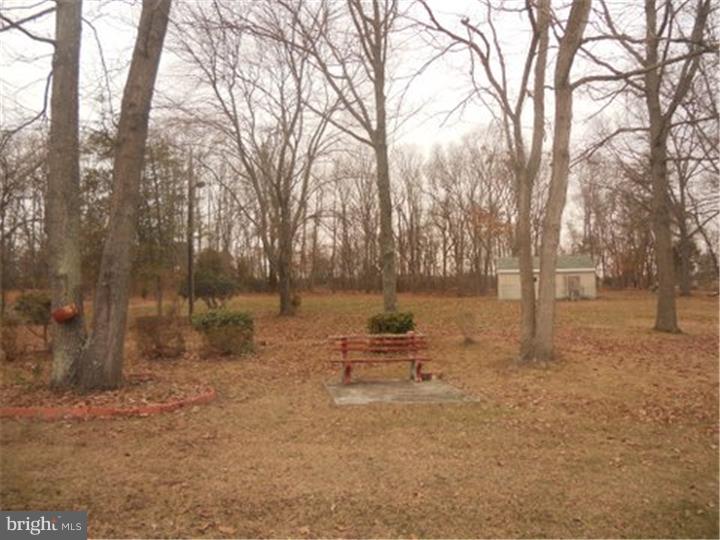 2762 Garwood Road Sicklerville, NJ 08081 - Photo 11 of 12 a backyard of a house with lots of green space and trees