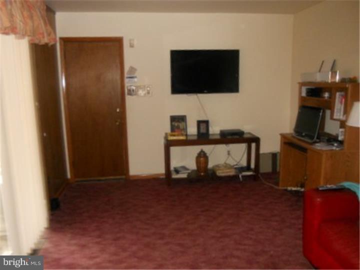 2762 Garwood Road Sicklerville, NJ 08081 - Photo 4 of 12 a room with furniture and a flat screen tv