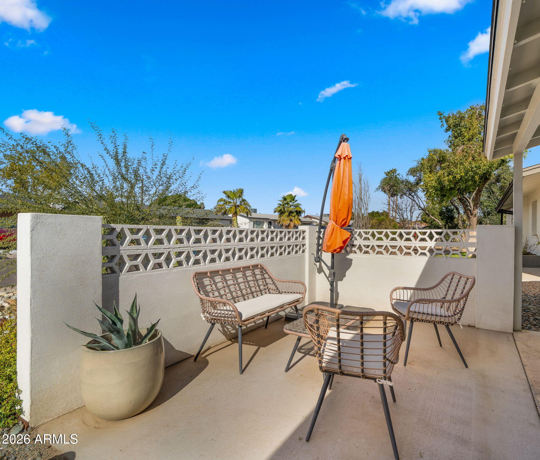 2115 North Normal Avenue Tempe, AZ 85288 - Photo 29 of 38 a view of a patio with a table and chairs and potted plants