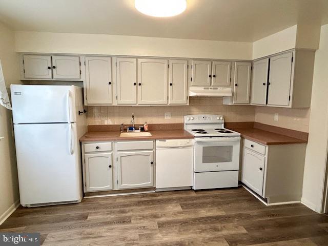 10 Kettle Court, Unit 76F Windsor Mill, MD 21244 - Photo 3 of 11 a kitchen with white cabinets and white appliances