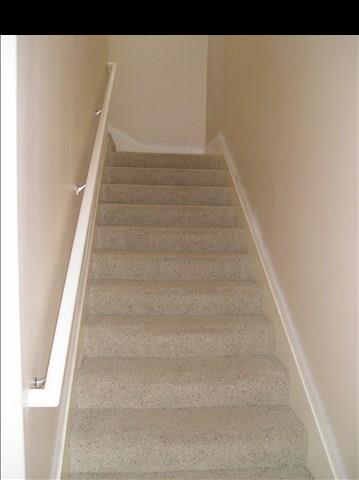 2748 Lower Kula Road Kula, HI 96790 - Photo 5 of 12 a view of staircase with white walls