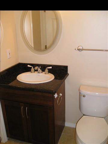 2748 Lower Kula Road Kula, HI 96790 - Photo 7 of 12 a bathroom with a sink and a mirror