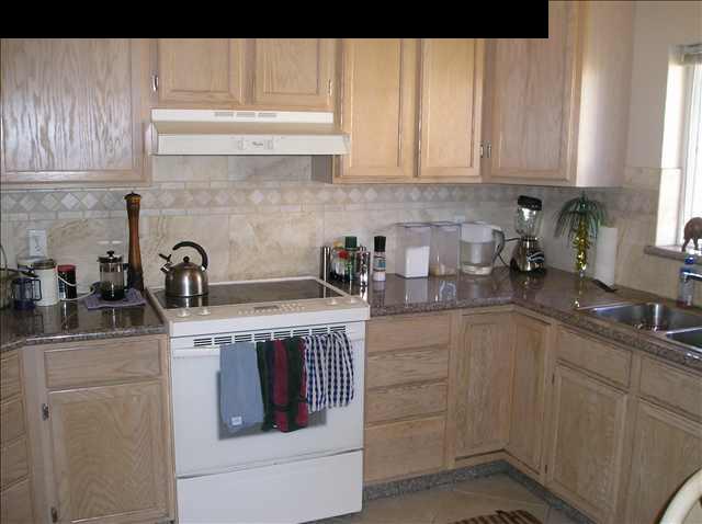 2748 Lower Kula Road Kula, HI 96790 - Photo 8 of 12 a kitchen with a sink and cabinets
