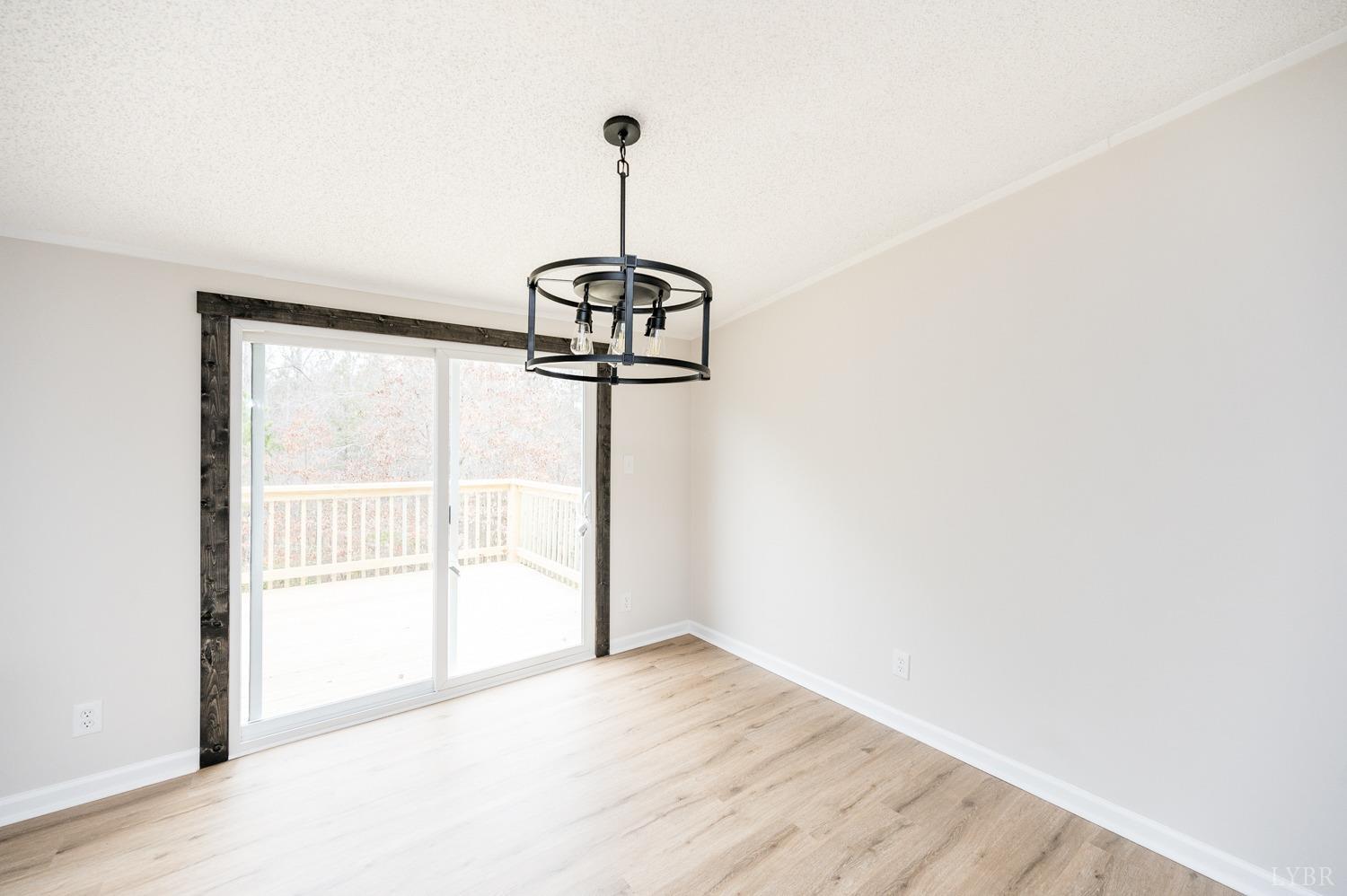 1636 Maddox Road Gladys, VA 24554 - Photo 11 of 54 a view of a room with a ceiling fan and a window