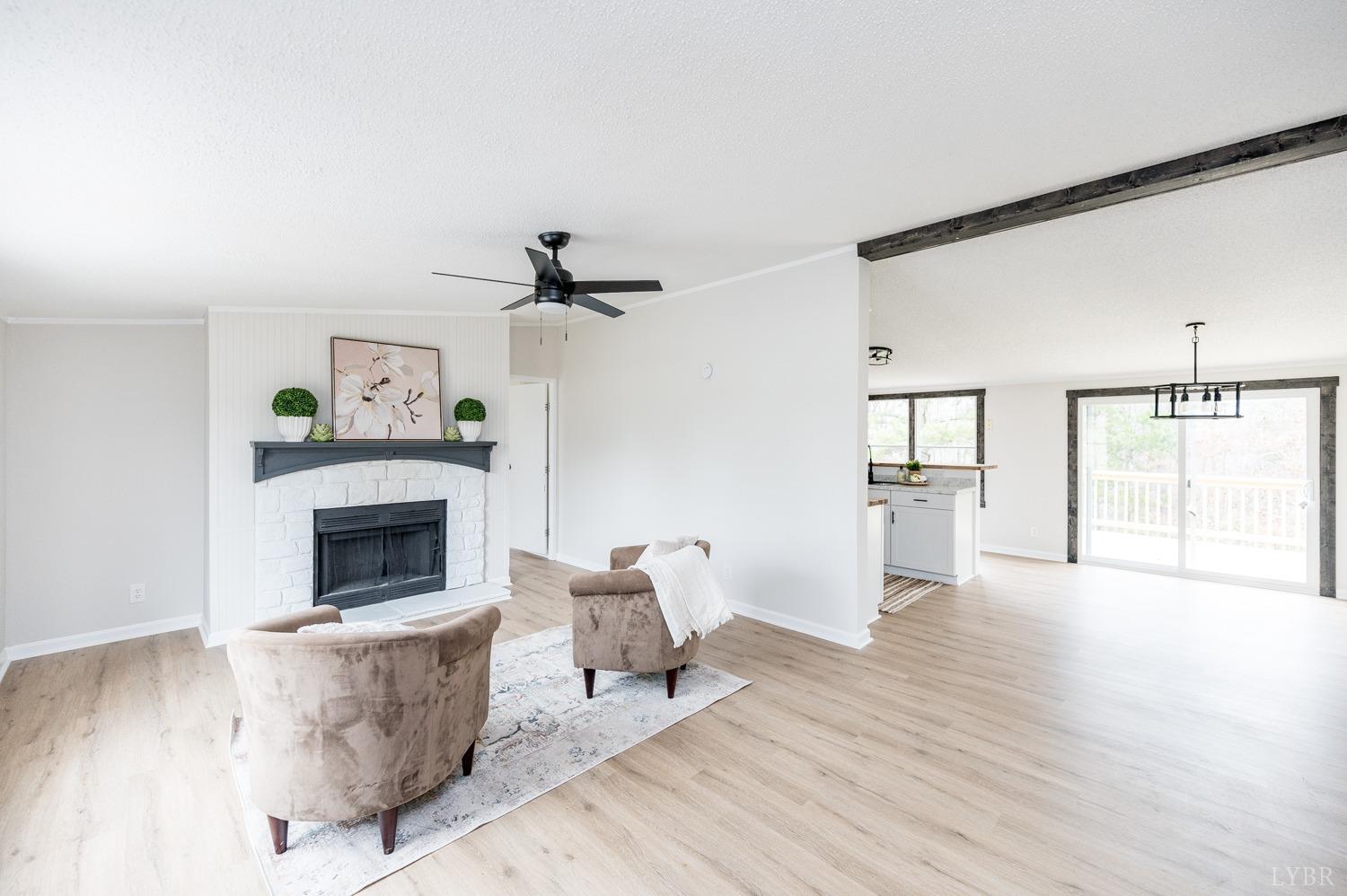 1636 Maddox Road Gladys, VA 24554 - Photo 13 of 54 a living room with furniture and a fireplace
