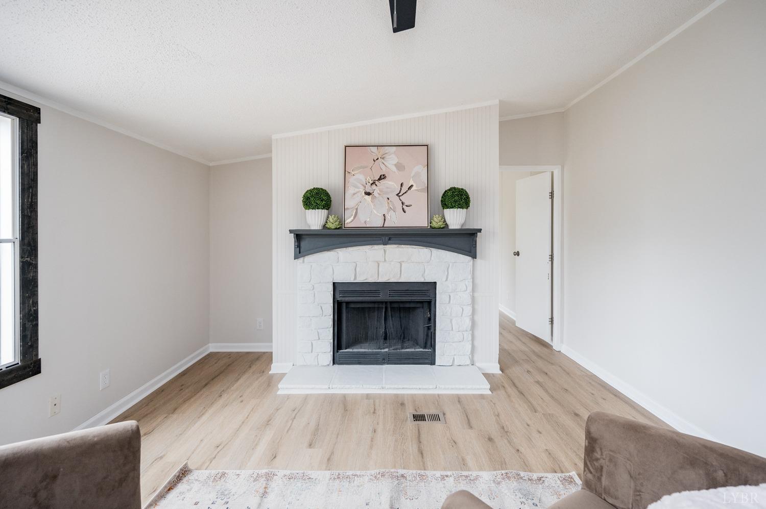 1636 Maddox Road Gladys, VA 24554 - Photo 14 of 54 a living room with furniture and a fireplace