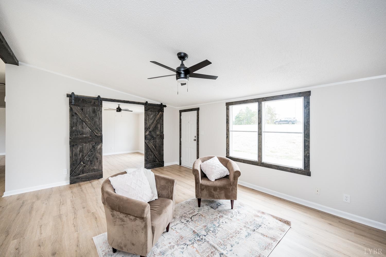 1636 Maddox Road Gladys, VA 24554 - Photo 15 of 54 a living room with furniture and a large window