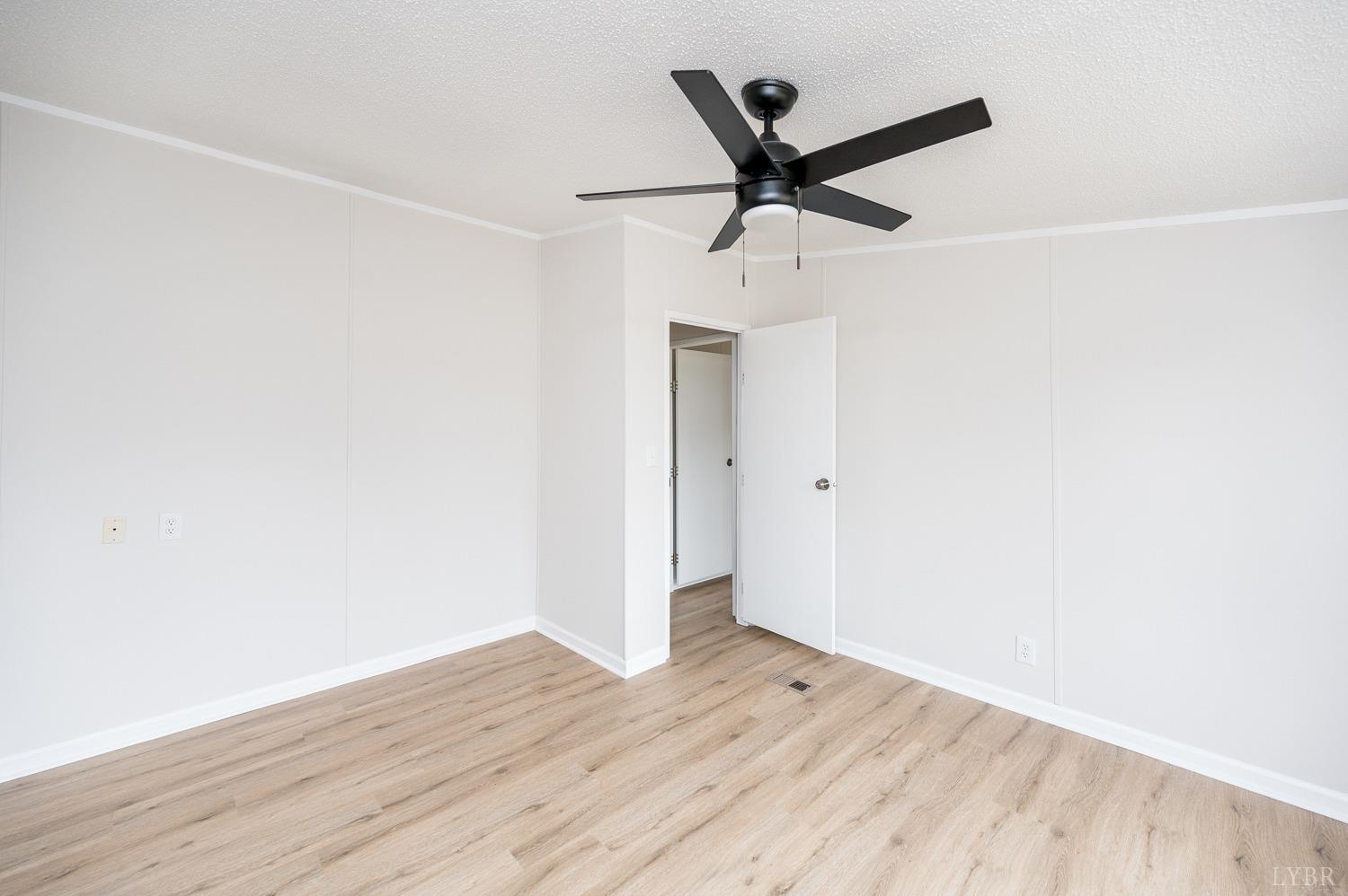 1636 Maddox Road Gladys, VA 24554 - Photo 21 of 54 a view of a big room with wooden floor and windows