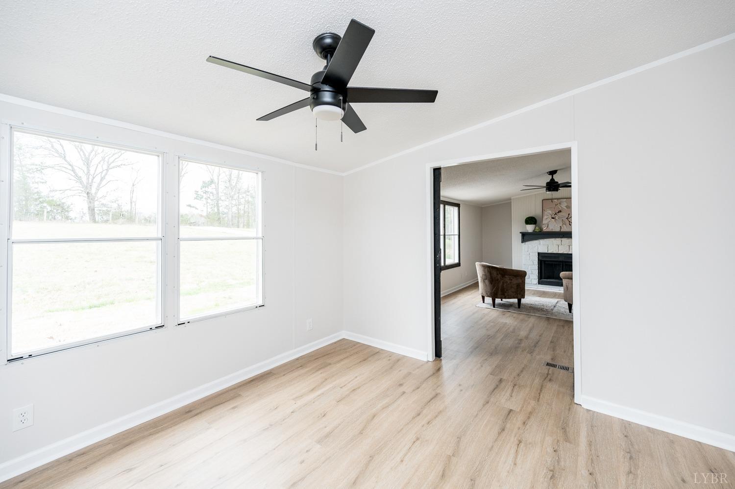 1636 Maddox Road Gladys, VA 24554 - Photo 22 of 54 a view of a livingroom with a ceiling fan and window