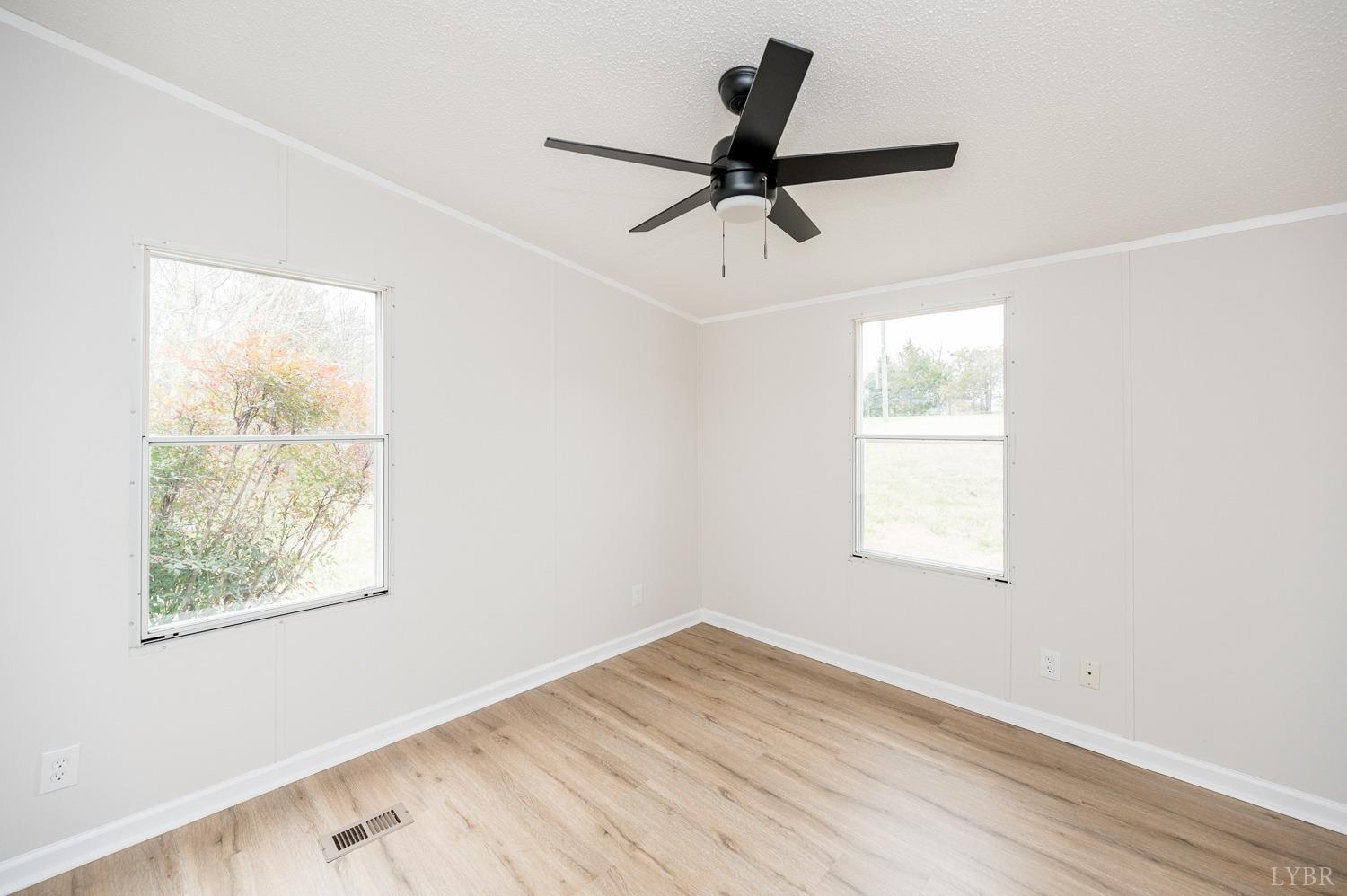 1636 Maddox Road Gladys, VA 24554 - Photo 26 of 54 a view of empty room with wooden floor and window