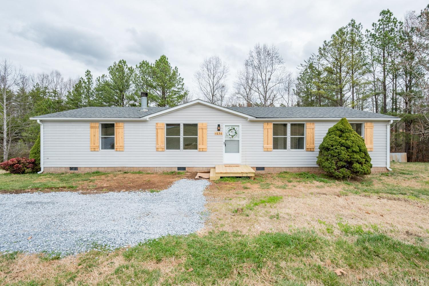 1636 Maddox Road Gladys, VA 24554 - Photo 41 of 54 a view of a yard with a house and garden