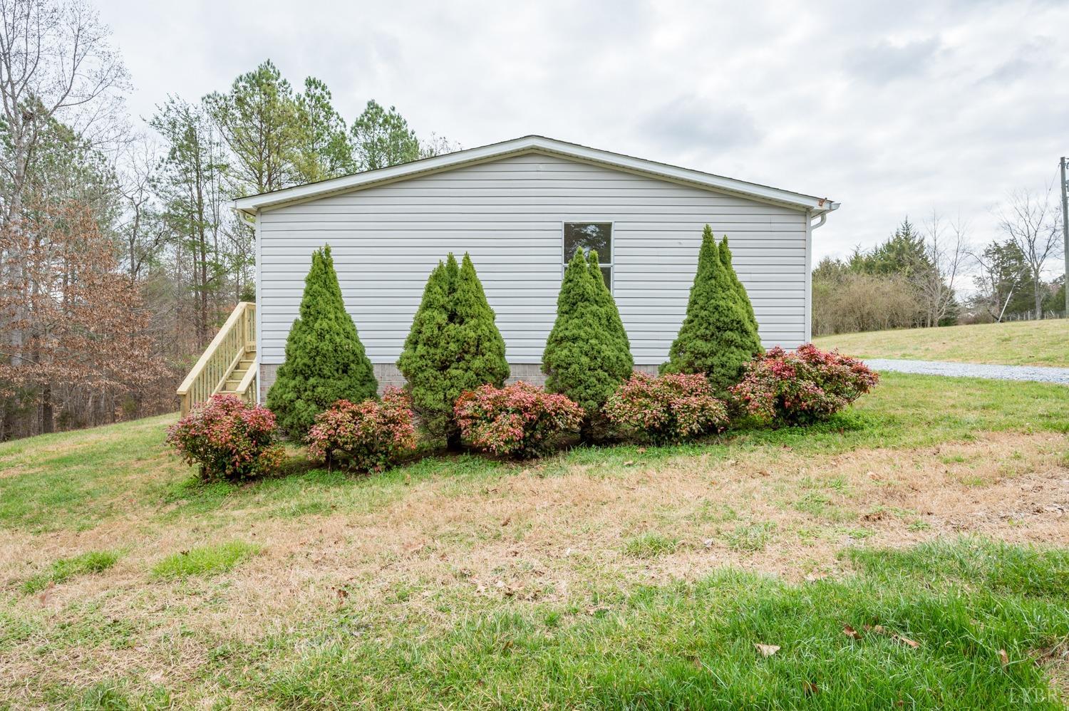 1636 Maddox Road Gladys, VA 24554 - Photo 44 of 54 a view of a house with backyard and garden