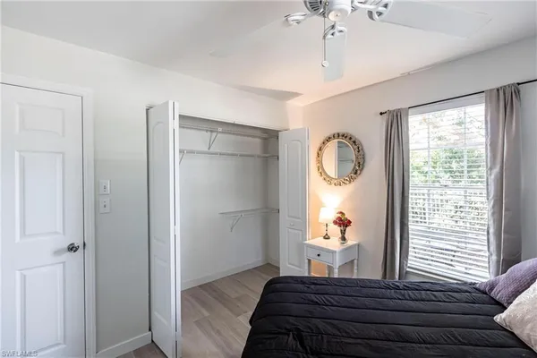 a bedroom with bed and window