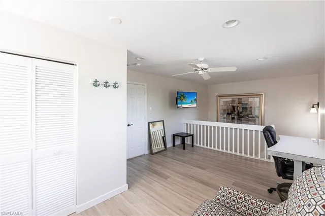 a bedroom with a bed and a table in it