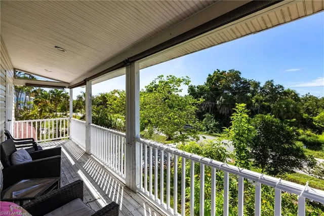 a view of a backyard with sitting area
