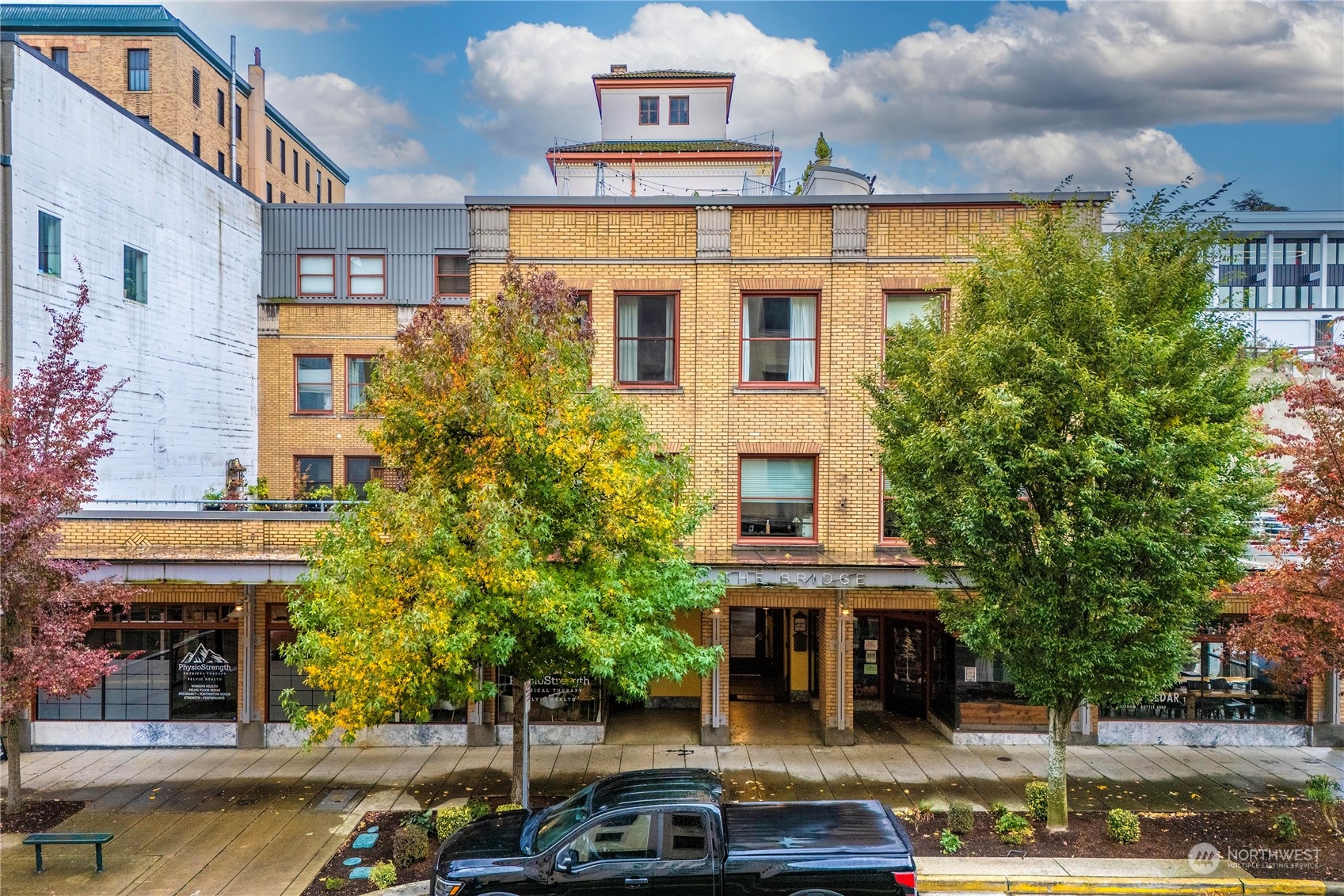 a front view of a building with street view