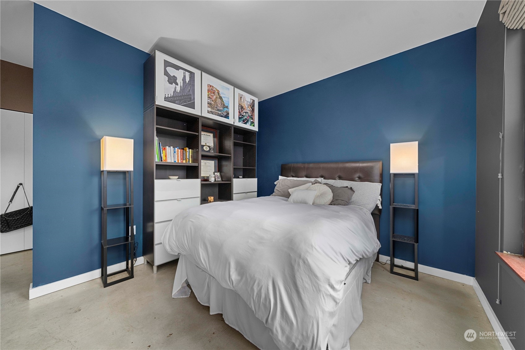 744 Market Street, Unit 302 Tacoma, WA 98402 - Photo 13 of 28 a bedroom with a bed and walk in closet