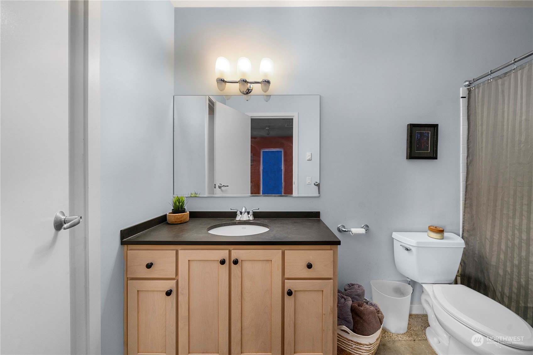 744 Market Street, Unit 302 Tacoma, WA 98402 - Photo 14 of 28 a bathroom with a granite countertop sink and a toilet