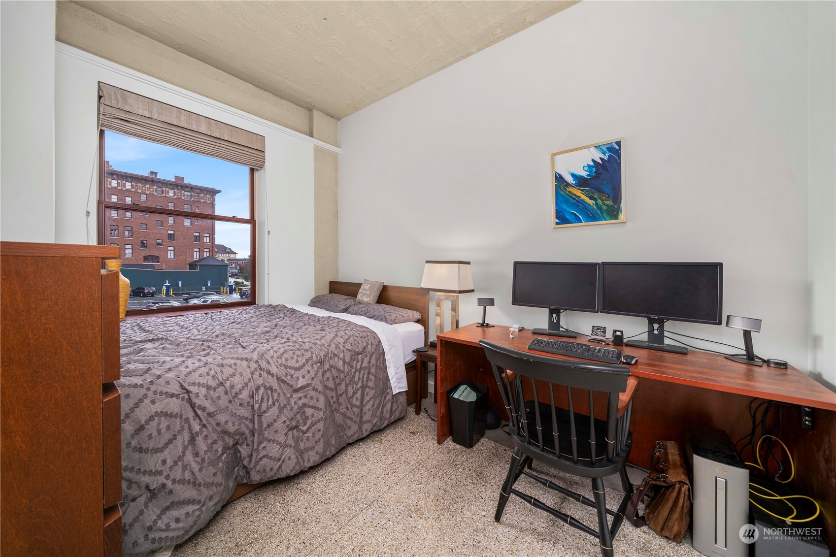 744 Market Street, Unit 302 Tacoma, WA 98402 - Photo 15 of 28 a bedroom with a bed and a desk