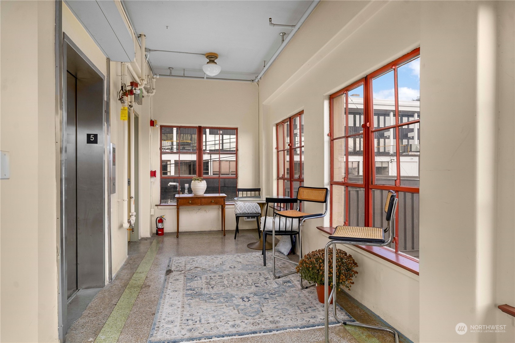 744 Market Street, Unit 302 Tacoma, WA 98402 - Photo 19 of 28 a living room with furniture and a window