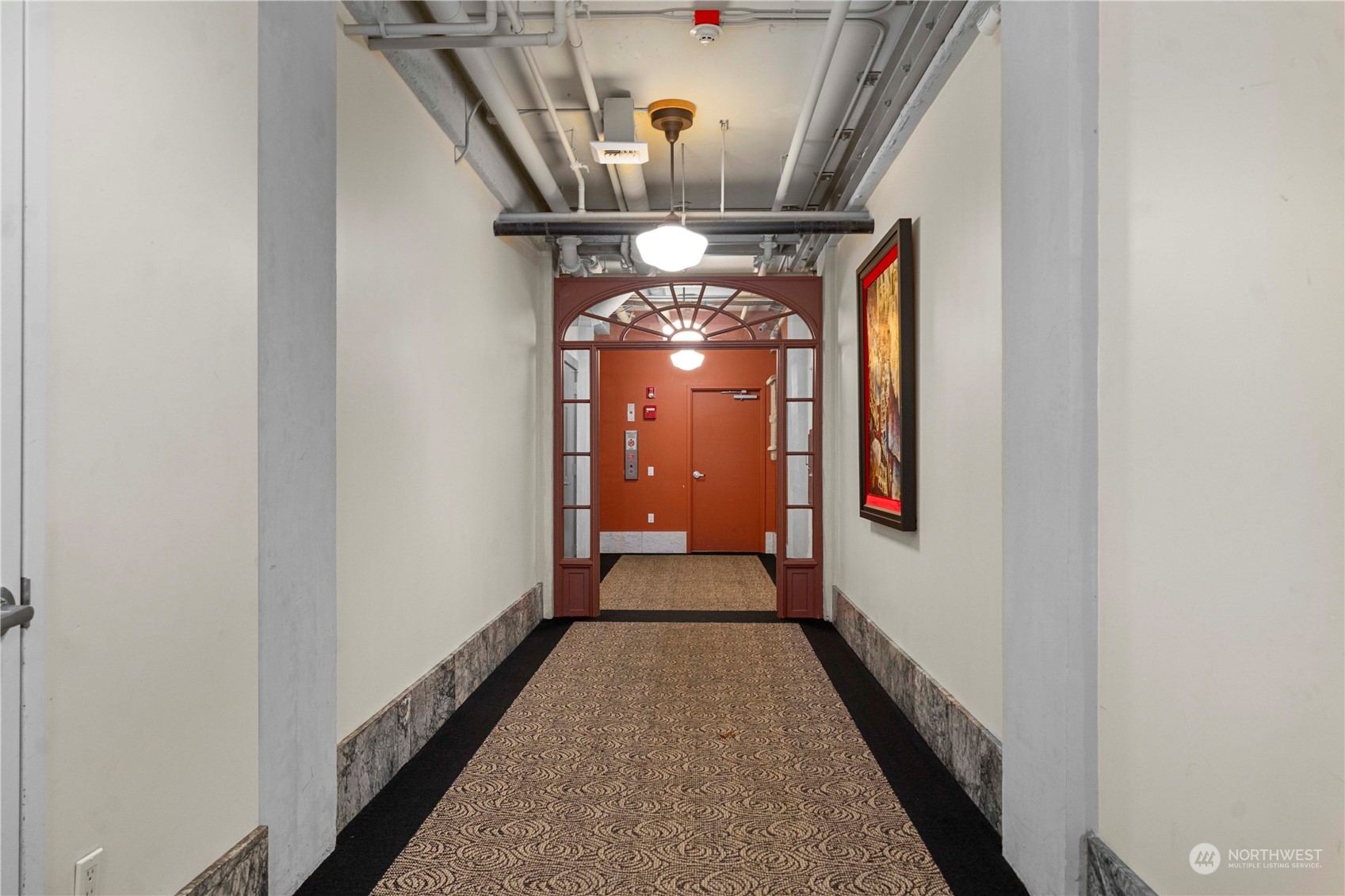 744 Market Street, Unit 302 Tacoma, WA 98402 - Photo 3 of 28 a view of a hallway view with staircase