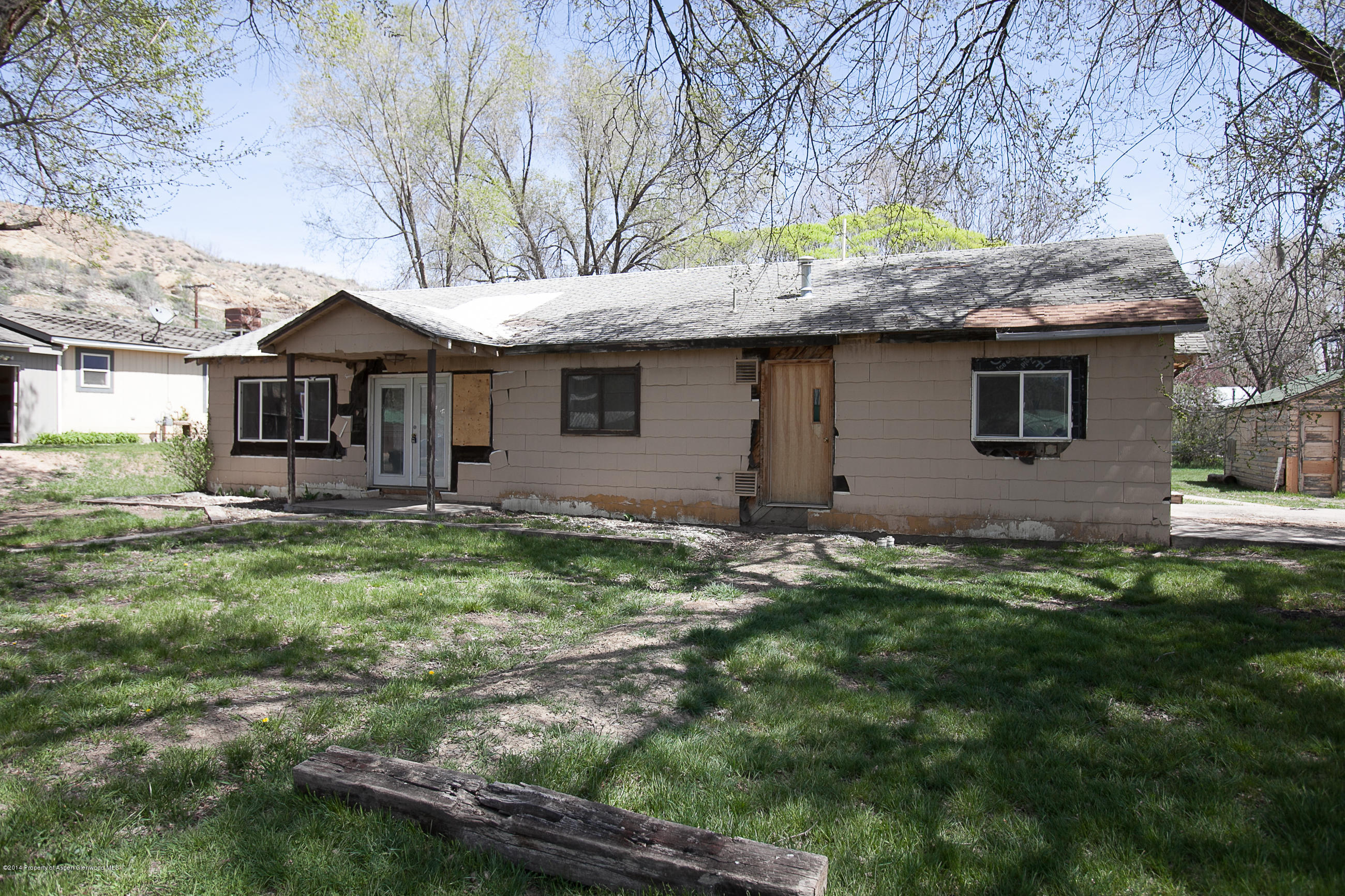 132 Ray Avenue Rifle, CO 81650 - Photo 1 of 10 a front view of a house with a garden